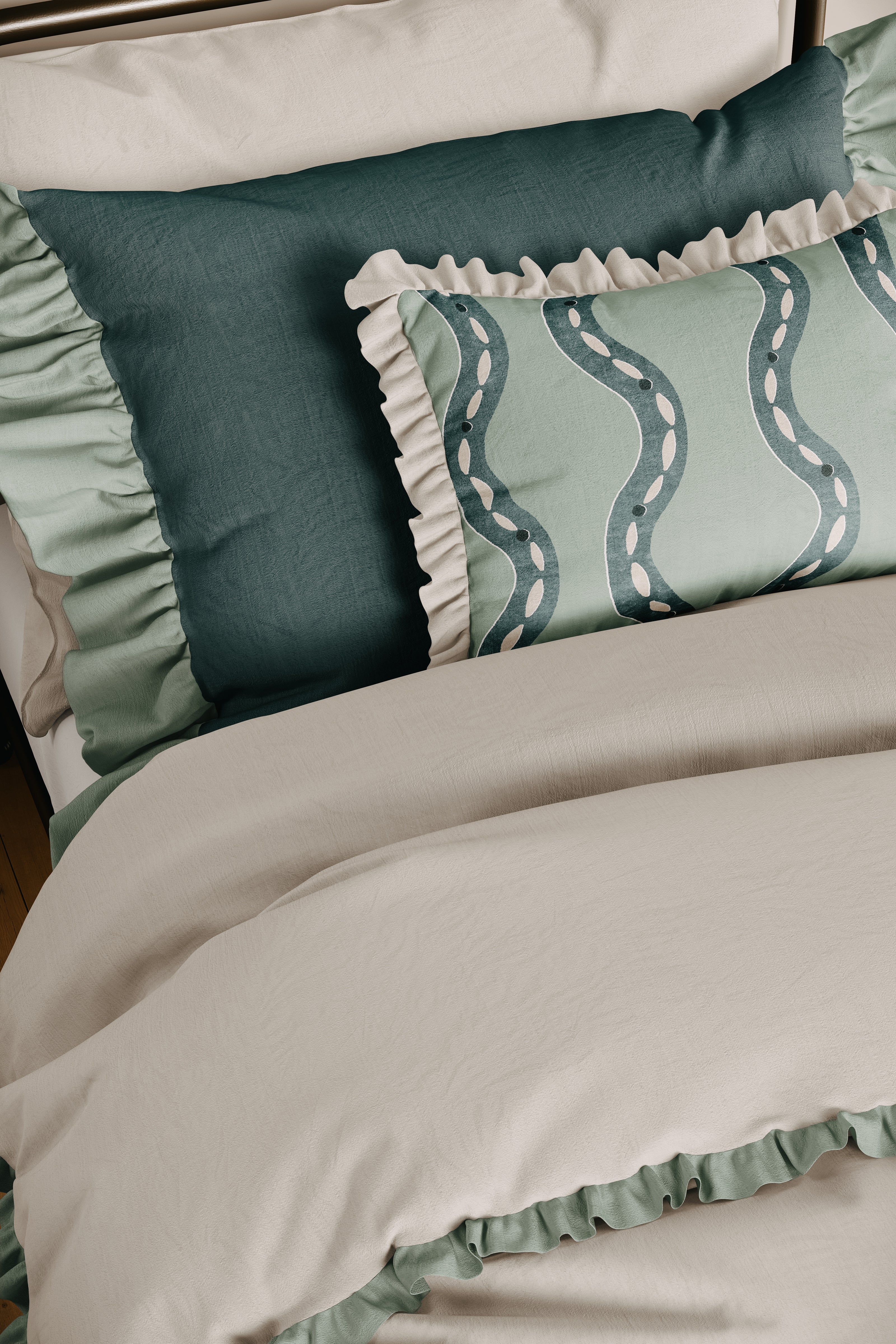 Green and beige bedding set with ruffled edges on a bed.