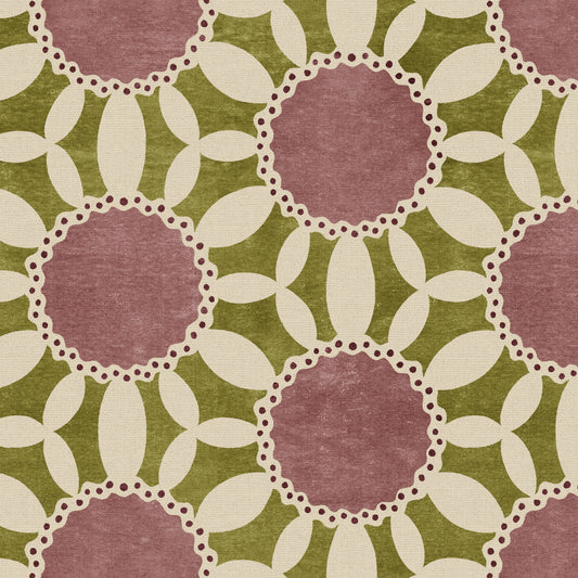 Patterned fabric with pink circles on a green background
